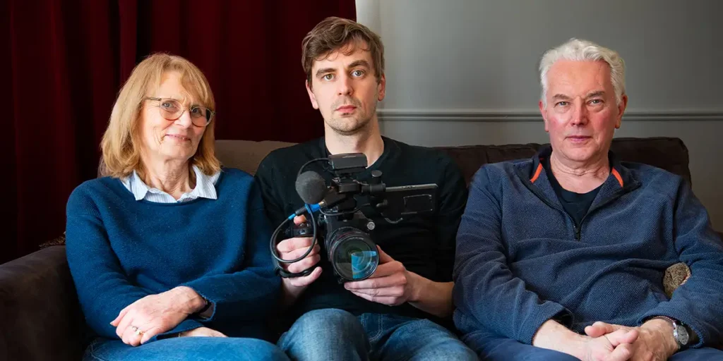 Ducan Cowles and two interviewees in a still from the film Silent Men