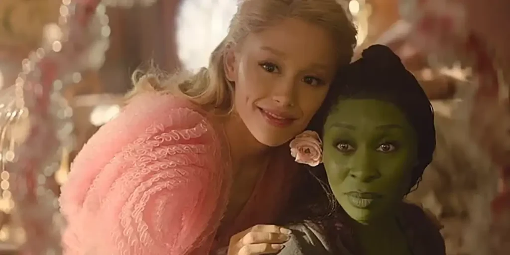 Glinda and Elphaba hug each other in a still from Wicked (2024), a movie we have many reasons to be excited about