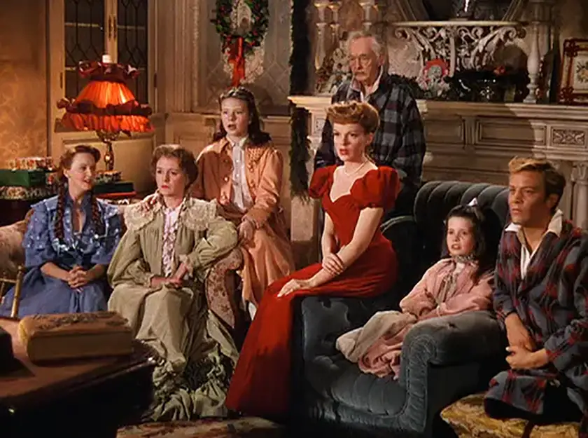 The family in Meet Me In St. Louis, one of the 10+ movies to watch for Christmas 2024 this year according to Loud And Clear Reviews