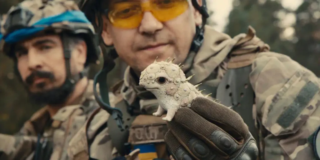 A soldier holds a porcelain figure in the film Porcelain War