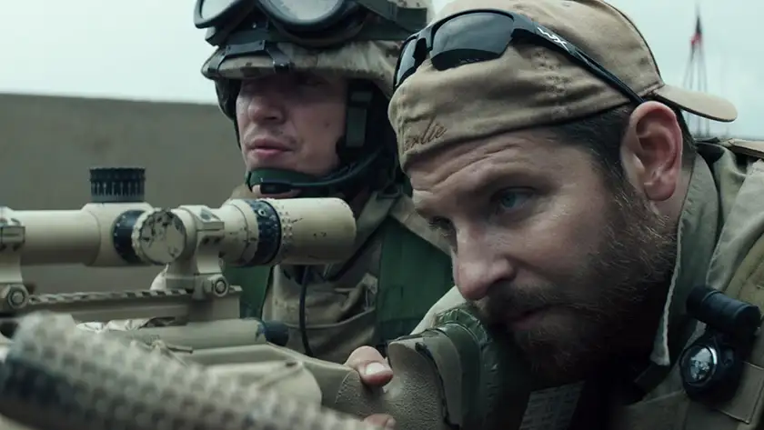 Bradley Cooper holds a rifle and aims in American Sniper, one of all 8 2015 best picture nominees ranked from worst to best by Loud And Clear Reviews