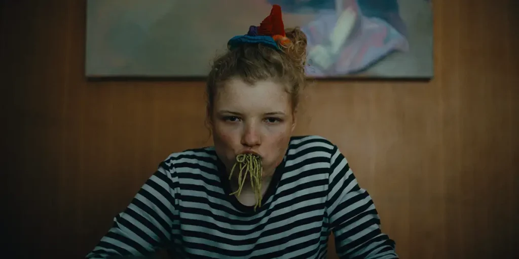 Luisa-Céline Gaffron eats pasta in How to Be Normal and the Oddness of the Other World