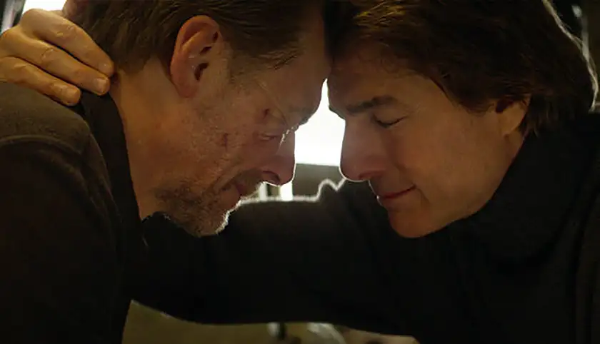 Simon Pegg and Tom Cruise are face to face in a still from Mission: Impossible 8 - The Final Reckoning, of which this article explores everything we know about