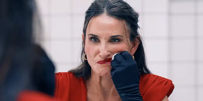 Demi Moore takes her makeup off in The Substance, one of the movies that analyze aging in Hollywood