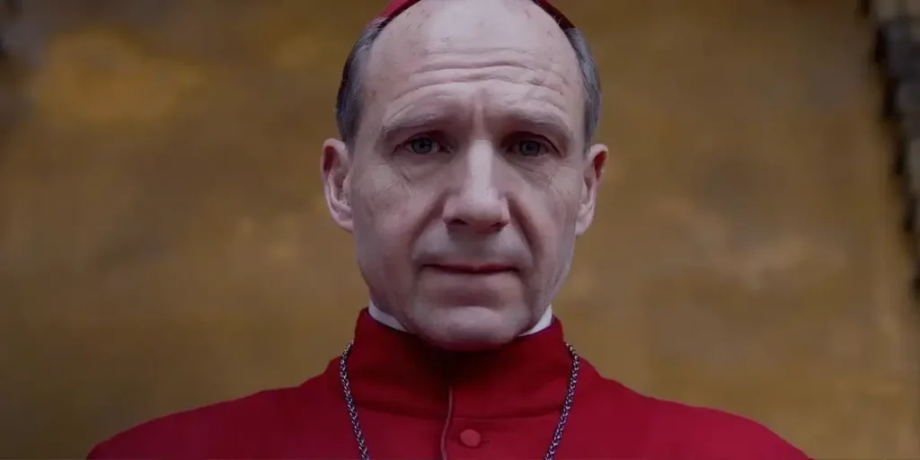 Ralph Fiennes looks down in the final scene of the movie Conclave