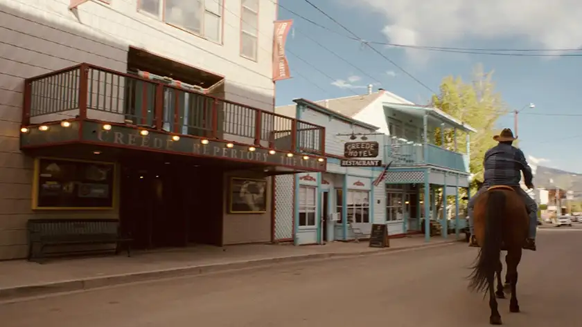 A longtime town resident rides his horse down Main Street by Creede Repertory Theatre in a still from the documentary film Creede U.S.A.