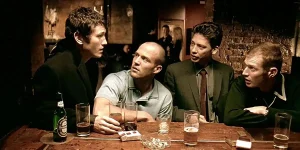 Four men sit at the pub in Lock, Stock and Two Smoking Barrels