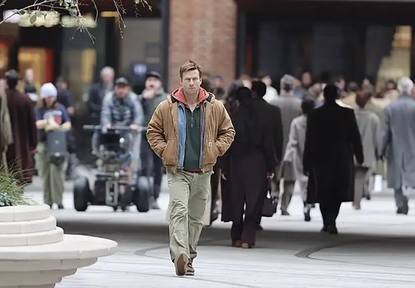 Glen Powell filming The Running Man (2025) in London on November 12, in a still used in an article with everything we know about the Edgar Wright movie