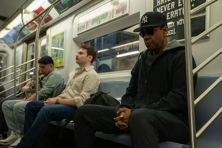 Denzel Washington sits on the subway in a still from the film Highest 2 Lowest, one of the 20 movies to watch at the 2025 Cannes film festival according to Loud and Clear Reviews