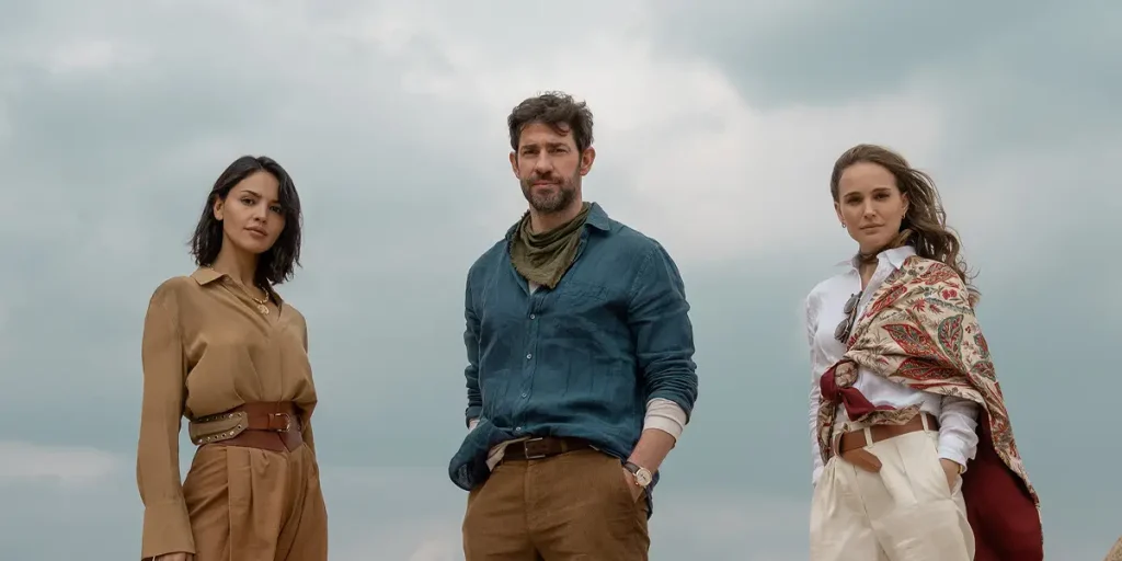 Eiza González, John Krasinski and Natalie Portman in a still from the Apple TV+ movie Fountain of Youth