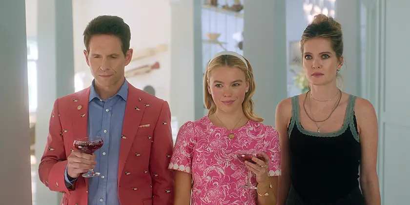 (L to R) Glenn Howerton as Ethan, Milly Alcock as Simone, Meghann Fahy as Devon in episode 101 of Sirens, the 2025 Netflix series