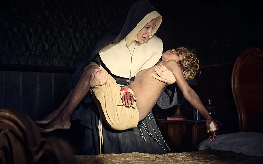 Cate Blanchett as Sister Eileen holds Aswan Reid as New Boy in a photo reminiscent of religious imagery in the film The New Boy