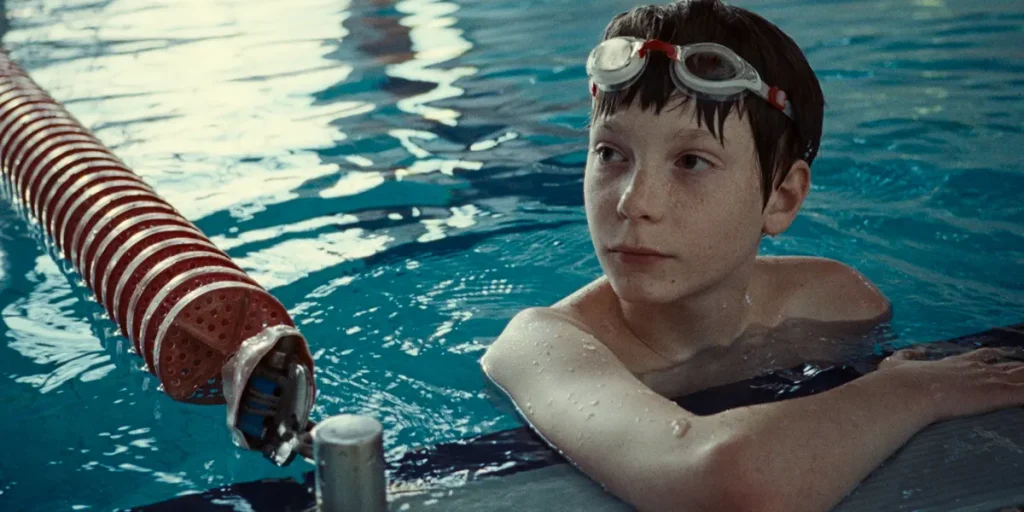 Everett Blunck is in a swimming pool in a still from Charlie Polinger's 2025 film The Plague