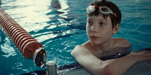 Everett Blunck is in a swimming pool in a still from Charlie Polinger's 2025 film The Plague
