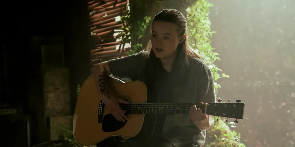 Bella Ramsey plays the guitar in episode 4 of The Last Of Us Season 2