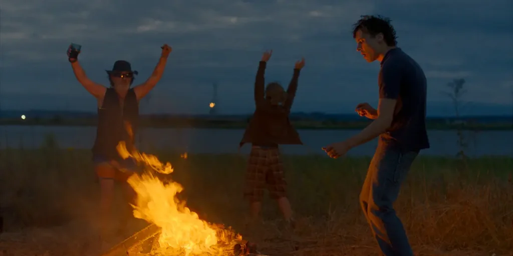 Frank Dillane, Karyna Khymchuk and Amr Waked are on the beach in the film Urchin