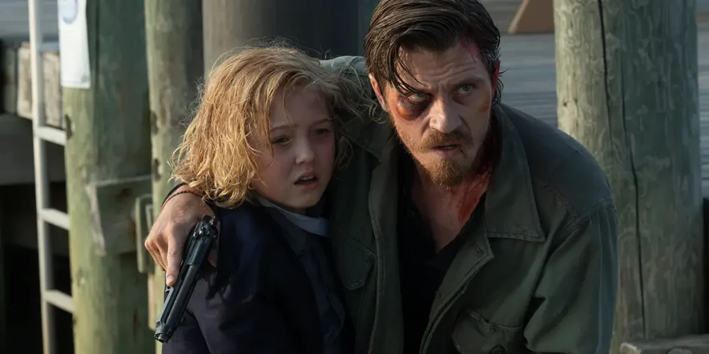 [L - R] Christian Convery as “Ethan” and Garrett Hedlund as “Caleb ” in Barron's Cove