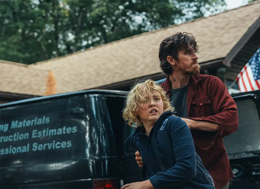 [L - R] Christian Convery as “Ethan” and Garrett Hedlund as “Caleb ” in Barron's Cove