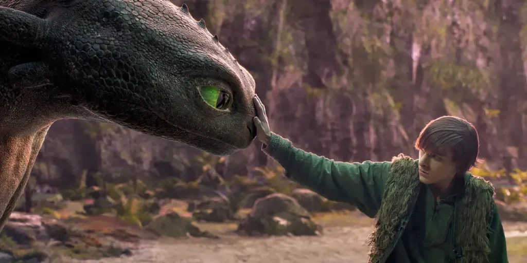 Mason Thames (right) as Hiccup with his Night Fury dragon, Toothless, in the How to Train Your Dragon (2025) live-action remake, written and directed by Dean DeBlois.