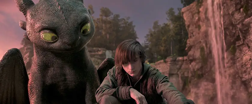 Mason Thames (left) as Hiccup with his Night Fury dragon, Toothless, in the How to Train Your Dragon (2025) live-action remake, written and directed by Dean DeBlois.