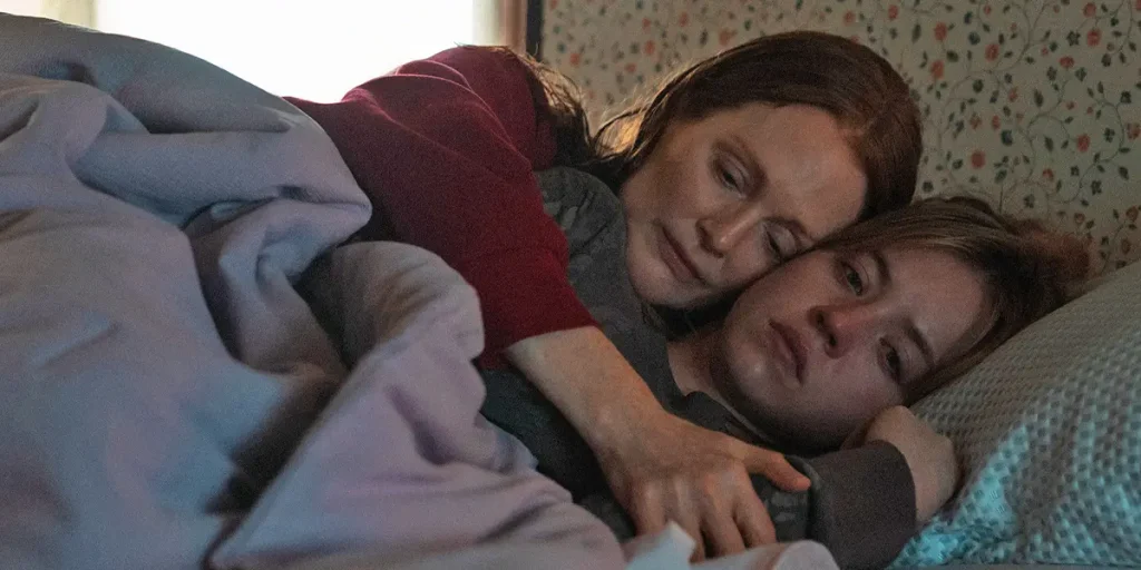 Julianne Moore hugs Sydney Sweeney in bed in the Apple TV+ movie Echo Valley (2025)