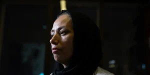 An Iranian woman looks ahead in the film An Eye for an Eye (2025)