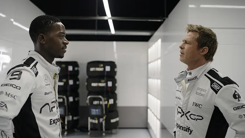 Damson Idris as Joshua Pearce and Brad Pitt as Sonny Hayes in “F1: The Movie”
