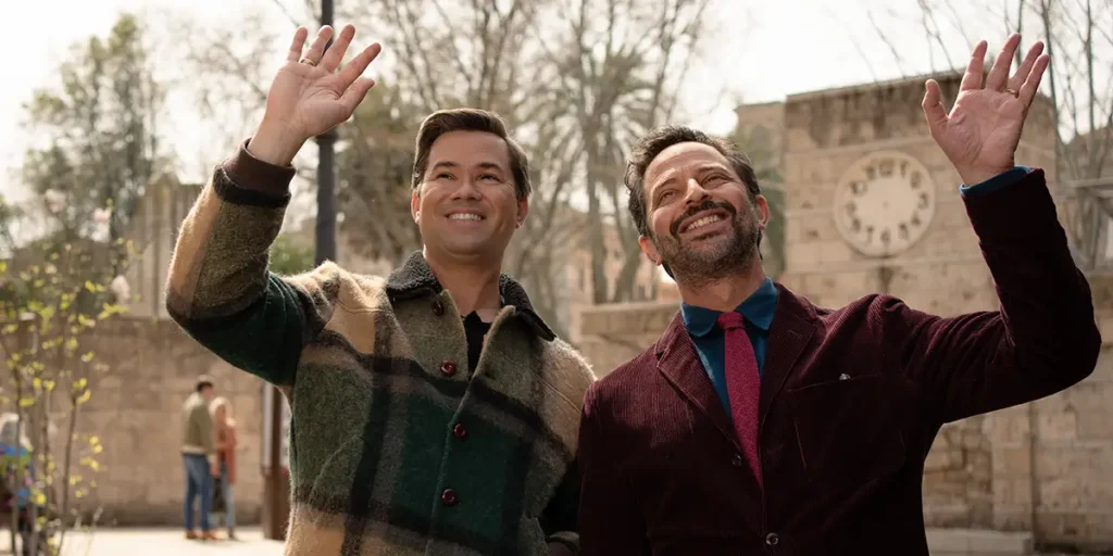 Nick Kroll and Andrew Rannells smile and wave in a still from the movie I Don’t Understand You