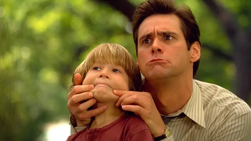 Jim Carrey and Justin Cooper in Liar Liar, one of the 10 must-watch witty comedies of the 90s listed by Loud And Clear Reviews