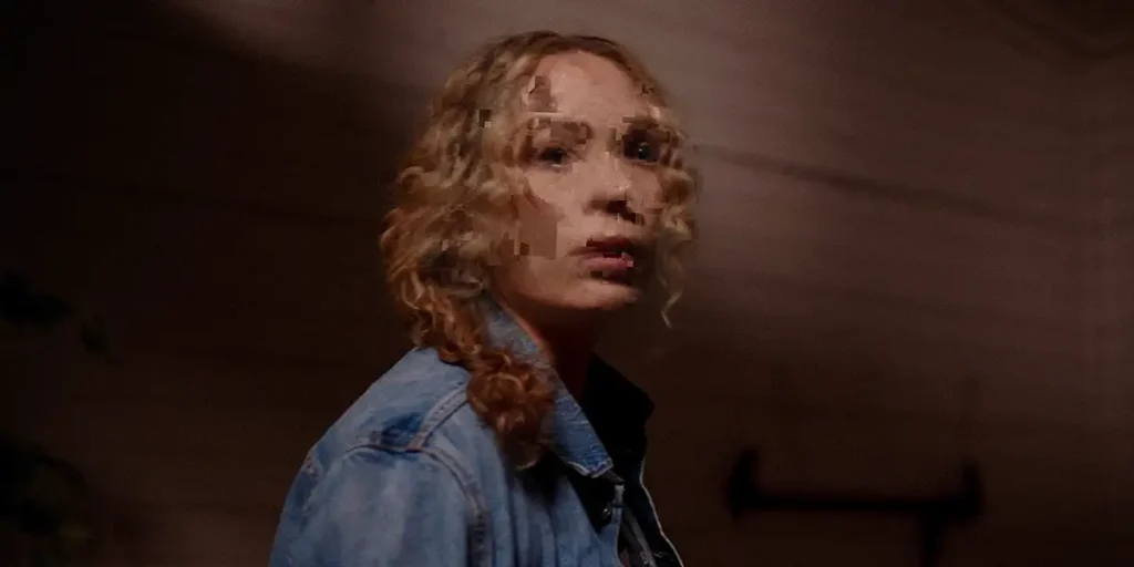 The grainy image of a woman captured by a camera in a still from the 2025 movie Man Finds Tape