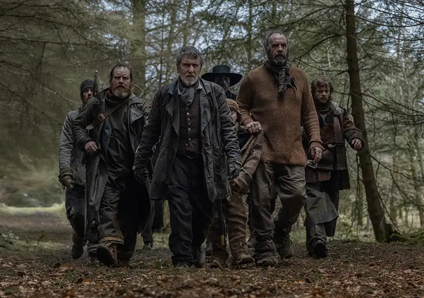 Tim Roth and Rory McCann lead a team of gangsters in a forest in the film Tornado (2025)