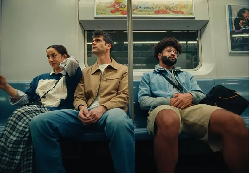 Naomi Asa, Anthony Oberbeck and Tristan Turner on the subway in a still from the film The Travel Companion