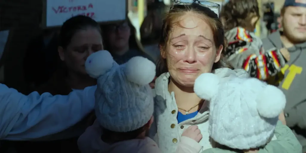 Aijah Lopez runs crying and holding plush toys in the short film "Watch Over Us" (2025)