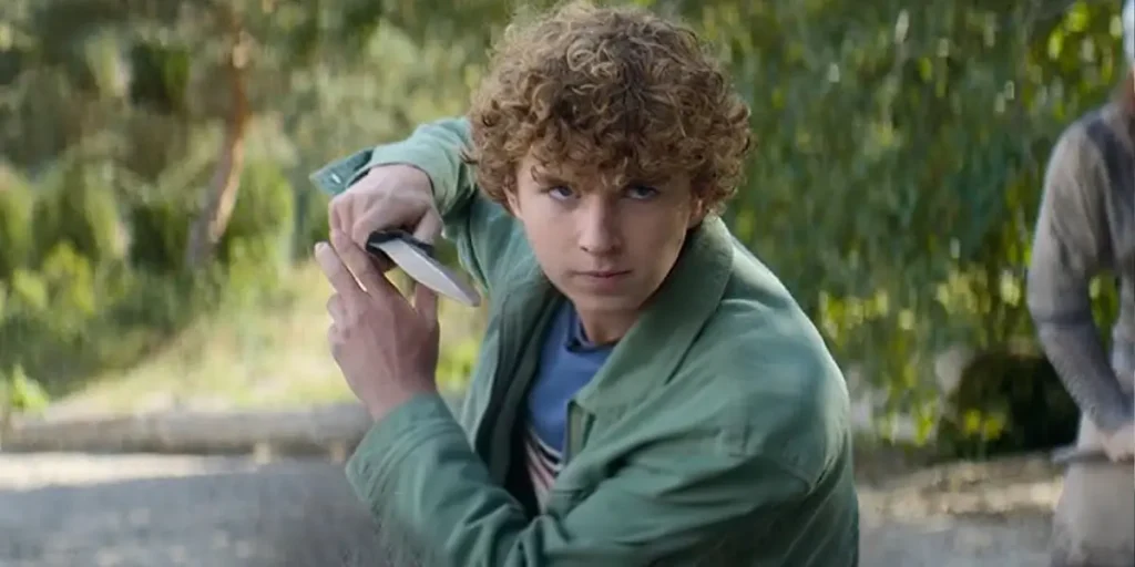Percy Jackson holds a sword in Season 2, in a picture featured in an article with everything we know from what we see in the trailer