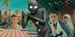 Stills from Asteroid City and The Phoenician Scheme, two films that explore faith, with the Asteroid City alien in the middle