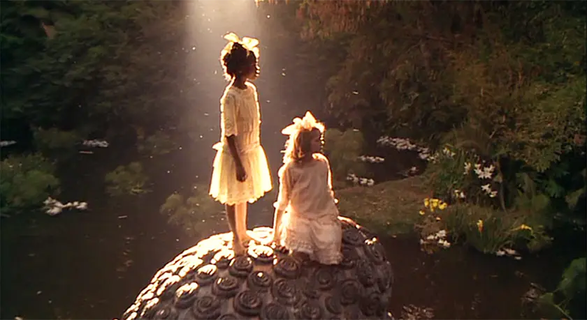 Two girls glow in a still from A Little Princess (1995) that shows Alfonso Cuarón's use of magic realism