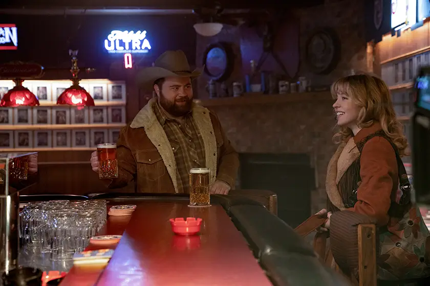 Paul Walter Hauser and Sydney Sweeney in Americana