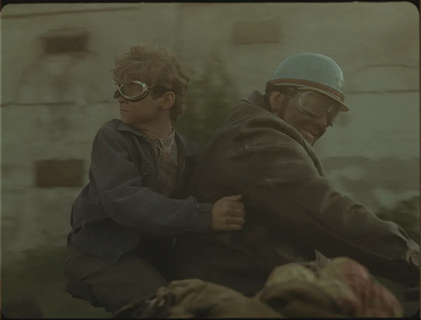 Two young men are on a motorbike in the film Orphan (Árva), from director László Nemes
