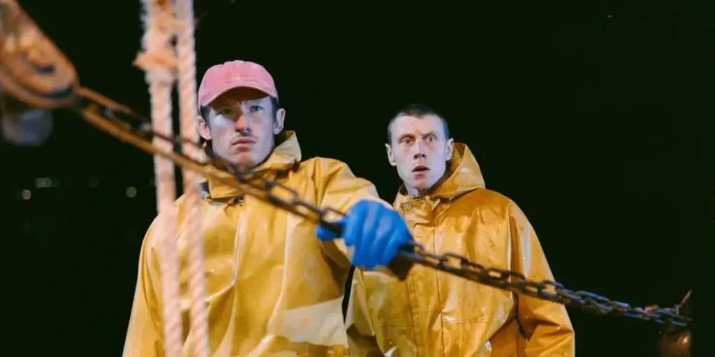 George MacKay and Callum Turner are on a boat in the movie Rose of Nevada