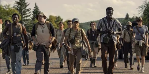 David Jonsson as McVries, Cooper Hoffman as Garraty, Jordan Gonzalez as Harkness, Ben Wang as Olson, and Tut Nyuot as Baker in a still from The Long Walk, a movie whose ending is explained in this article