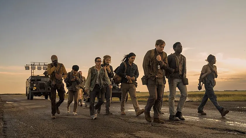 Tut Nyuot as Baker, Ben Wang as Olson, Jordan Gonzalez as Harkness, Charlie Plummer as Barkovitch, Joshua Odjick as Parker, Cooper Hoffman as Garraty, and David Jonsson as McVries in a still from The Long Walk, a movie whose ending is explained in this article