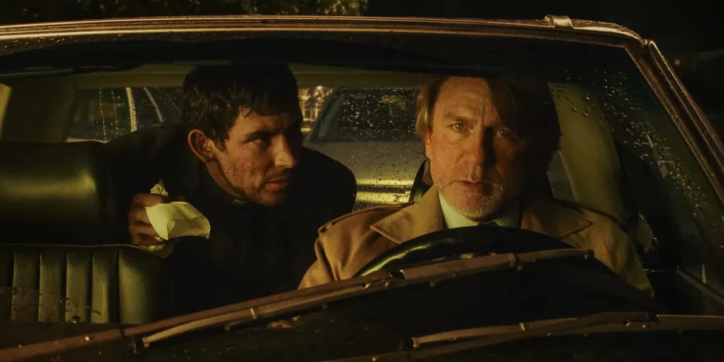 Josh O'Connor and Daniel Craig are in a car in Wake Up Dead Man: A Knives Out Mystery