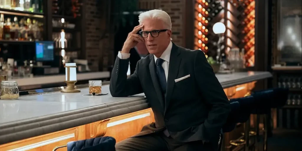 Ted Danson leans on a table in A Man on the Inside Season 2
