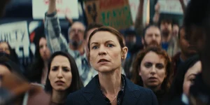 Claire Danes as Aggie Wiggs is in a crowd in Episode 103 of The Beast in Me