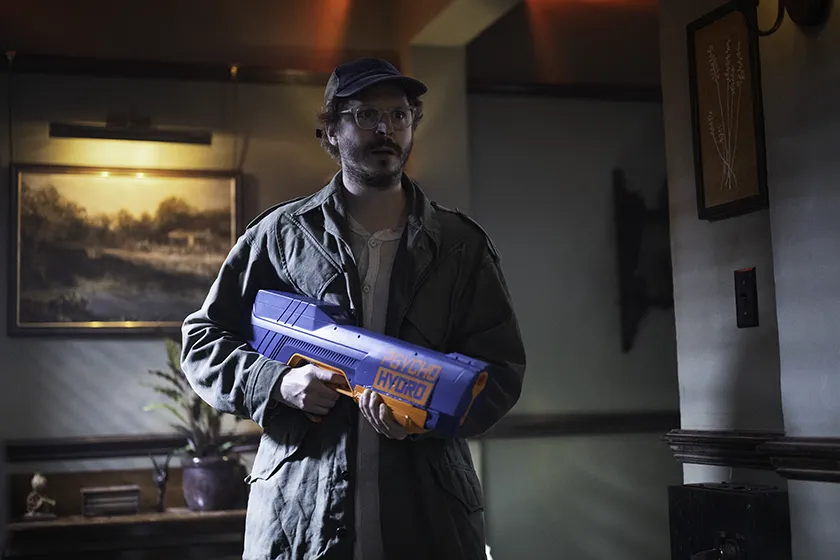 Michael Cera holds a Psycho Hydro Water gun in The Running Man