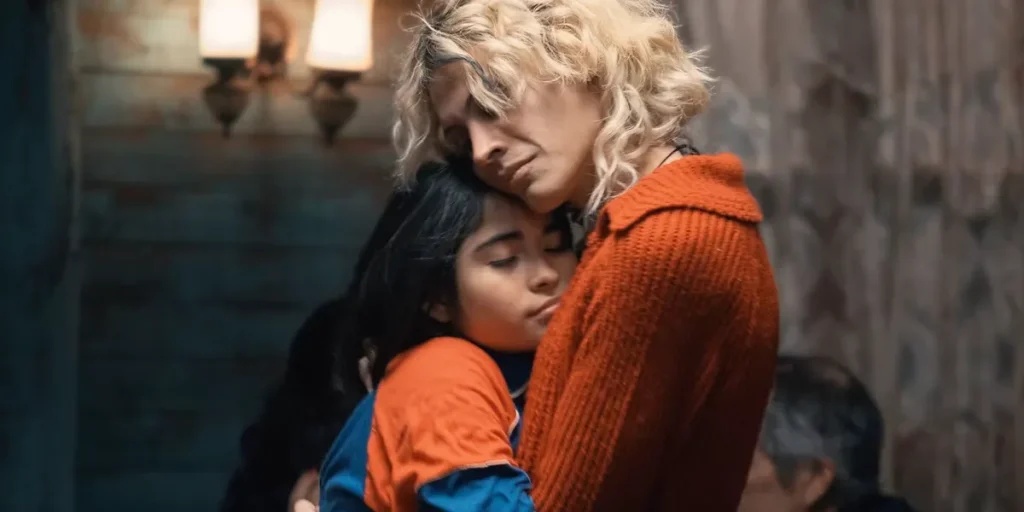A young woman and a child hug each other in The Mysterious Gaze of the Flamingo