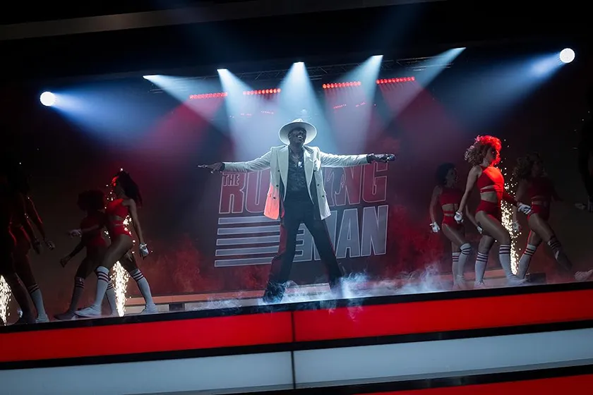 Colman Domingo in a still from the new Running Man movie (2025), which is better than the original according to Loud And Clear Reviews