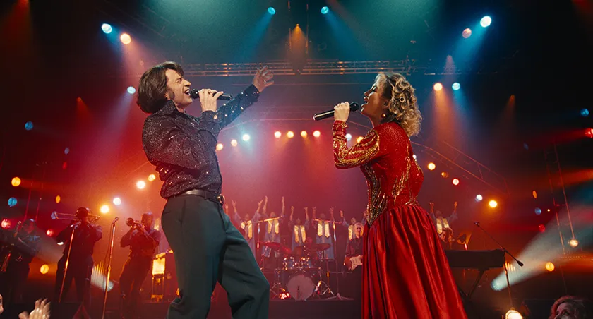 (L to R) Hugh Jackman as Mike Sardina and Kate Hudson as Claire Stengl in a still from Song Sung Blue, whose director, Craig Brewer, we interview