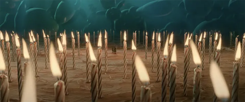 Haley Lu Richardson surrounded by giant candles in a scene shown in the trailer for Good Luck, Have Fun, Don't Die, whose DOP, James Whitaker, we interview