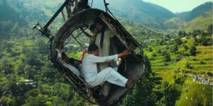 Mohammed Ali Naqvi and four other people are inside a broken cable car in a still from Hanging by a Wire (2026)